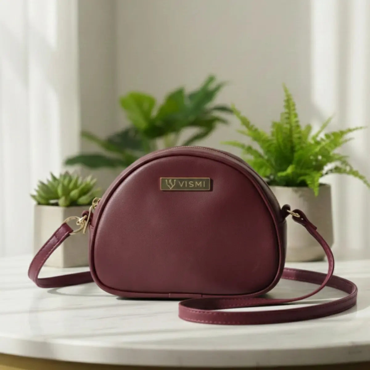 Women’s vegan leather crossbody sling bag with an adjustable strap and zippered compartments