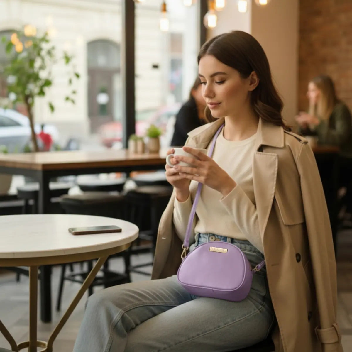 Women’s crossbody sling bag made from premium vegan leather with a sleek modern design