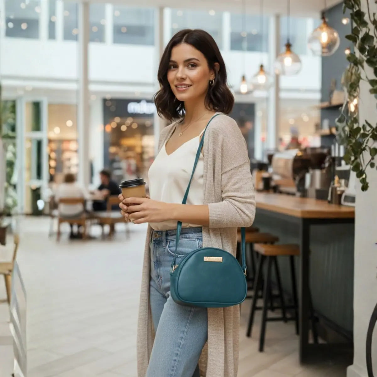 Vegan leather sling bag for women worn as a crossbody