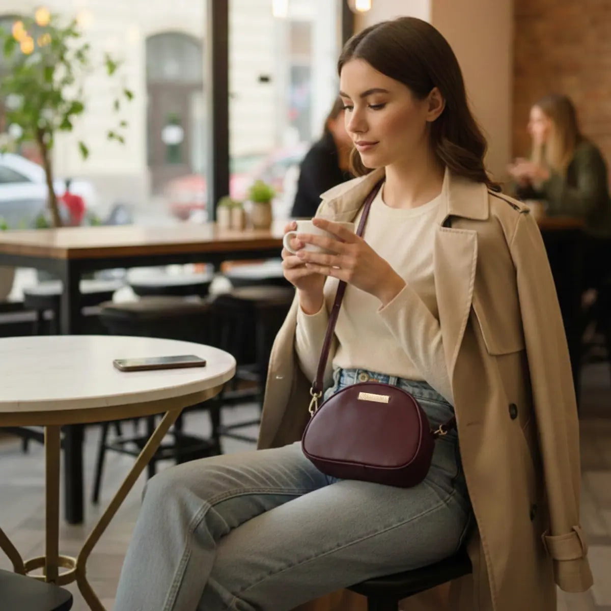 Women’s vegan leather crossbody sling bag with an adjustable strap and zippered compartments