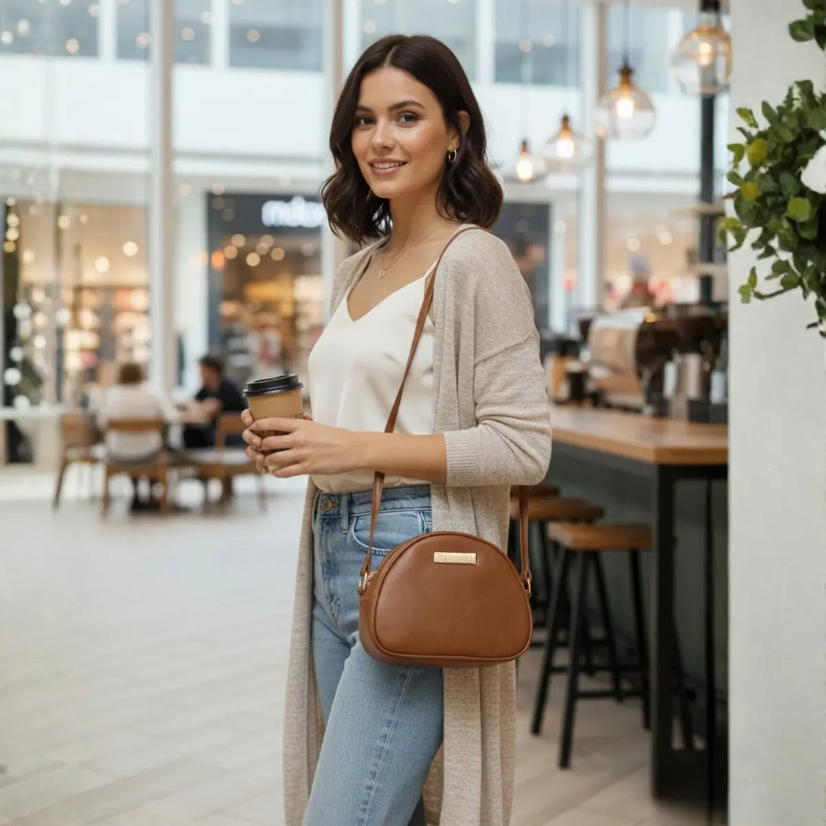 Women’s crossbody sling bag made from premium vegan leather with a sleek modern design.